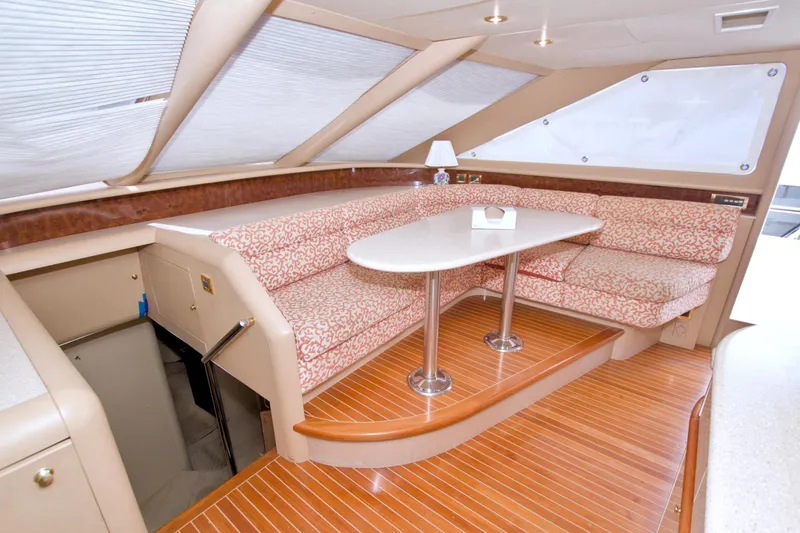 Slide: The Image of Luxurious interior of 1998 Lazzara 76 Skylounge Grand Salon yacht with elegant seating and table. - 50