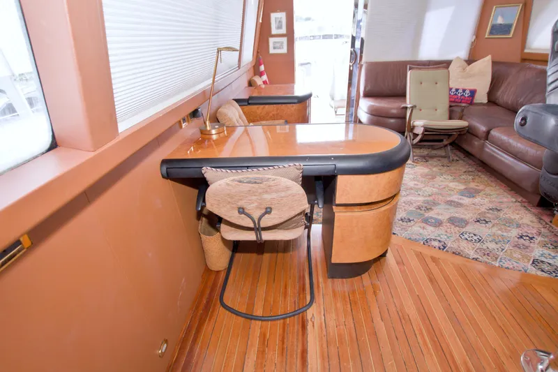 Slide: The Image of Interior of 1998 Lazzara 76 Skylounge Grand Salon with elegant wood furnishings and cozy seating. - 52