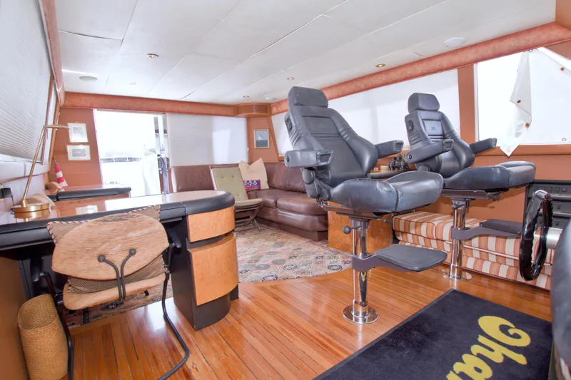 Slide: The Image of Luxurious interior of 1998 Lazzara 76 Skylounge Grand Salon yacht with leather seating and wooden flooring. - 53
