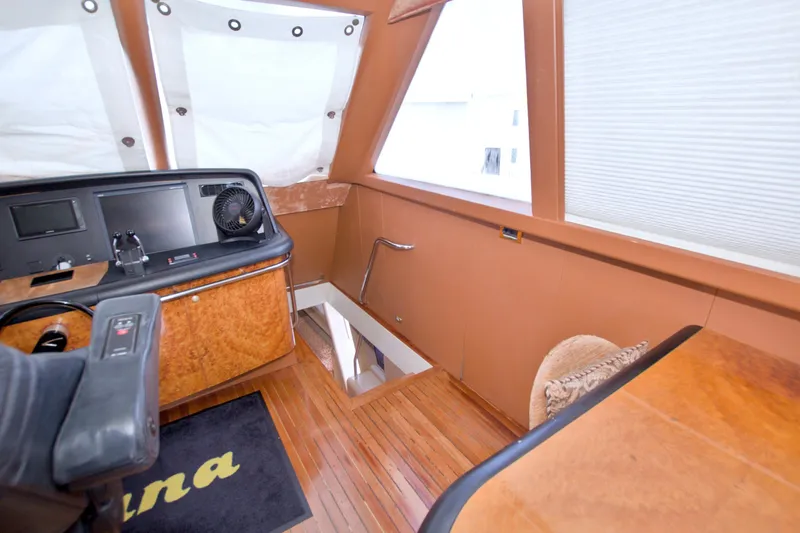 Slide: The Image of Luxurious interior of 1998 Lazzara 76 Skylounge Grand Salon yacht with helm station. - 69