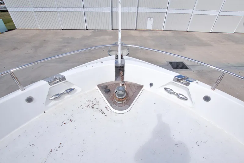 Slide: The Image of Bow of 1998 Lazzara 76 Skylounge Grand Salon yacht with anchor winch. - 74