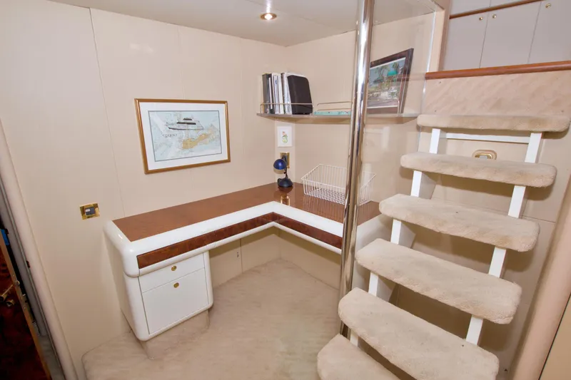 Slide: The Image of Interior of 1998 Lazzara 76 Skylounge Grand Salon with desk and carpeted stairs. - 84