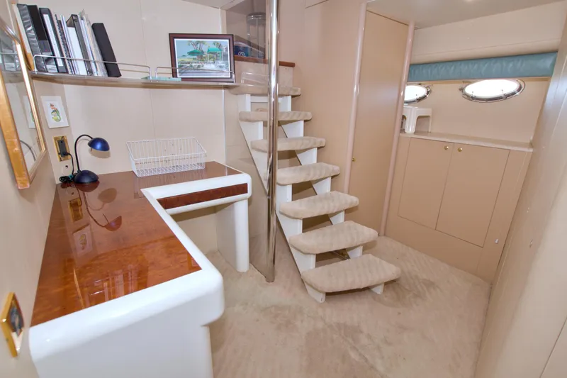 Slide: The Image of Luxurious interior of 1998 Lazzara 76 Skylounge Grand Salon yacht with staircase and desk. - 85