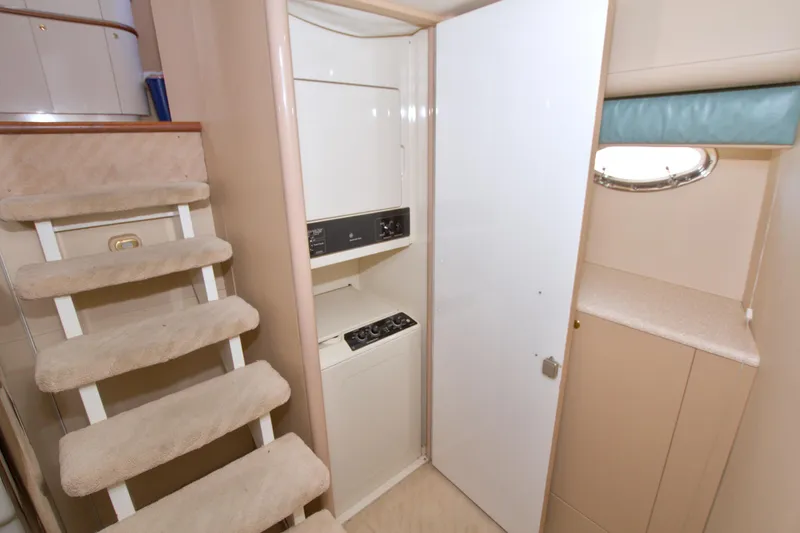 Slide: The Image of Interior of 1998 Lazzara 76 Skylounge Grand Salon with stairs and laundry area. - 86