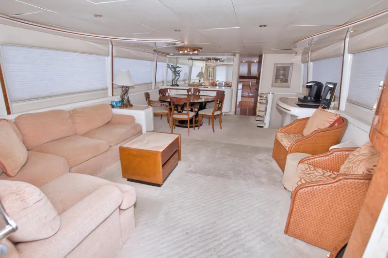 Slide: The Image of Luxurious interior of 1998 Lazzara 76 Skylounge Grand Salon yacht with elegant seating and dining area. - 9