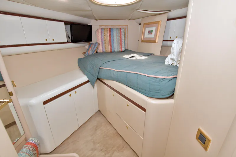 Slide: The Image of Cozy bedroom in 1998 Lazzara 76 Skylounge Grand Salon yacht with modern furnishings. - 94