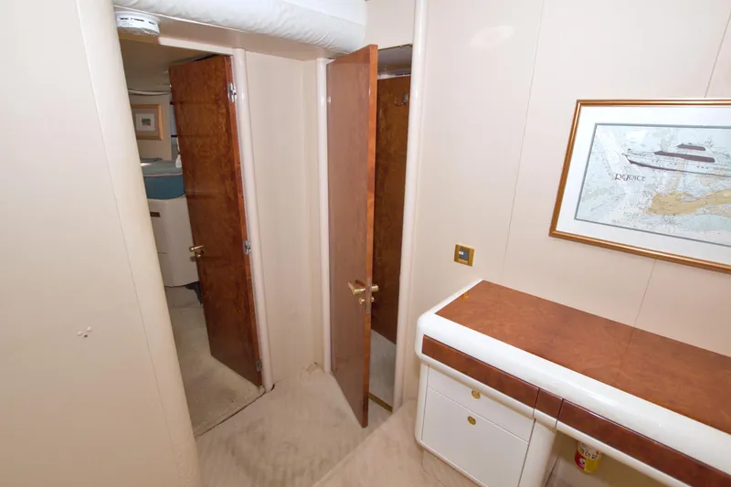 Slide: The Image of Interior hallway of 1998 Lazzara 76 Skylounge Grand Salon yacht with wood accents. - 96