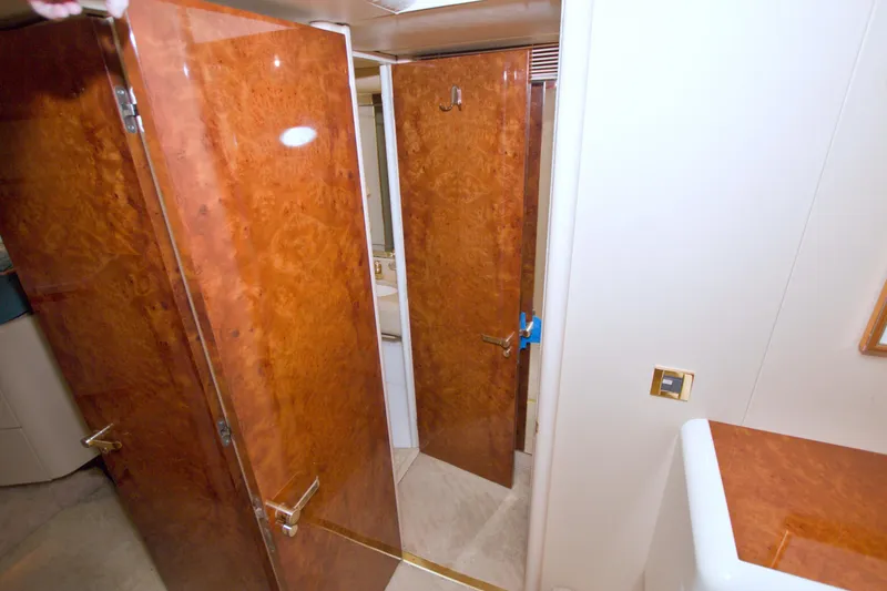 Slide: The Image of Luxurious wooden interior of 1998 Lazzara 76 Skylounge Grand Salon yacht bathroom. - 97