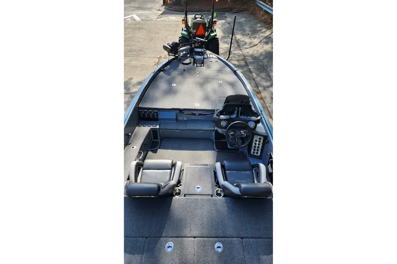 Slide: The Image of 2020 Phoenix 920 Elite boat interior with dual seats and steering console. - 5