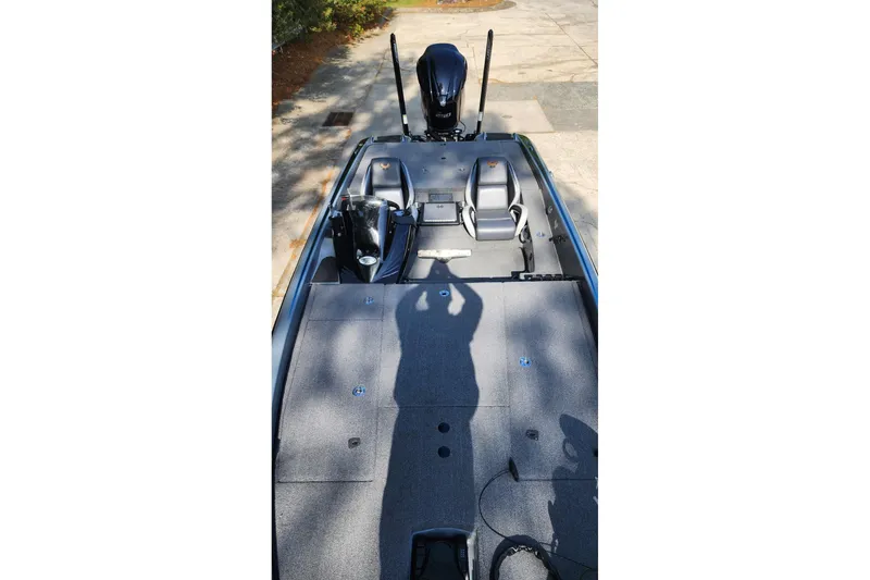 Slide: The Image of 2020 Phoenix 920 Elite boat interior with seating and motor, viewed from above. - 6
