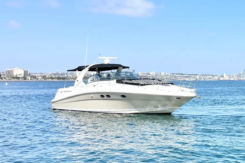 Slide: The Image of 2005 Sea Ray 390 Sundancer yacht cruising on a sunny day in open water. - 2