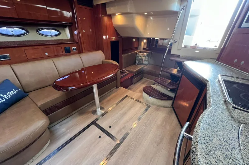 Slide: The Image of Luxurious interior of 2005 Sea Ray 390 Sundancer yacht with elegant wood finishes. - 26