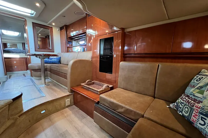 Slide: The Image of Luxurious interior of 2005 Sea Ray 390 Sundancer yacht with plush seating and wood finishes. - 35