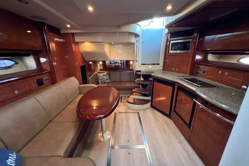Slide: The Image of Luxurious interior of a 2005 Sea Ray 390 Sundancer yacht with elegant wood finishes. - 37