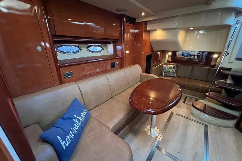 Slide: The Image of Luxurious interior of 2005 Sea Ray 390 Sundancer yacht with plush seating and elegant wood finishes. - 38