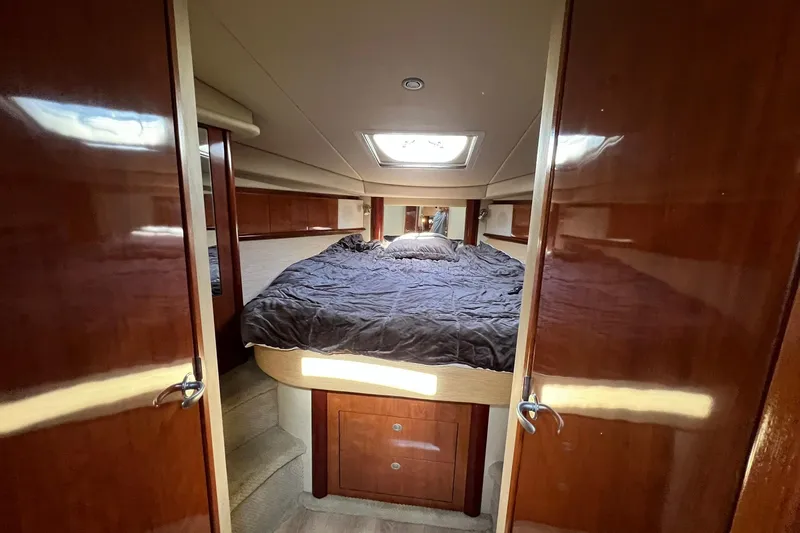 Slide: The Image of Luxurious cabin interior of 2005 Sea Ray 390 Sundancer yacht with cozy bed. - 47