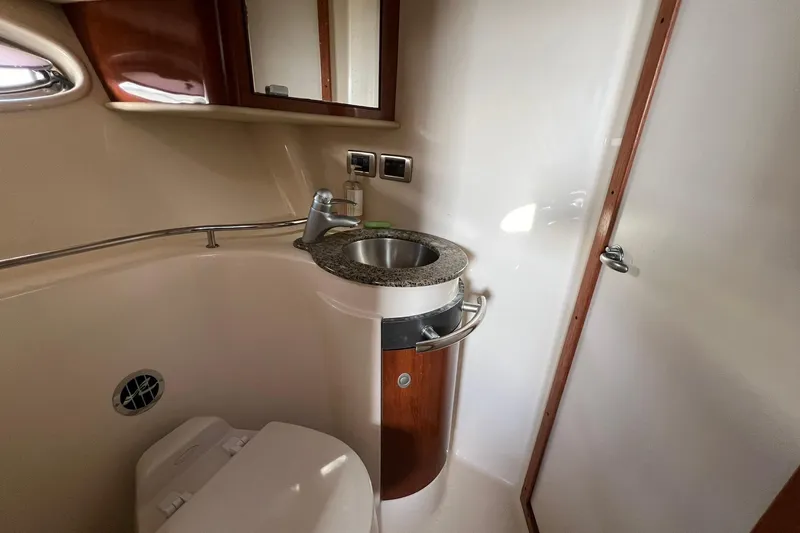 Slide: The Image of 2005 Sea Ray 390 Sundancer bathroom with sink, mirror, and toilet. - 53