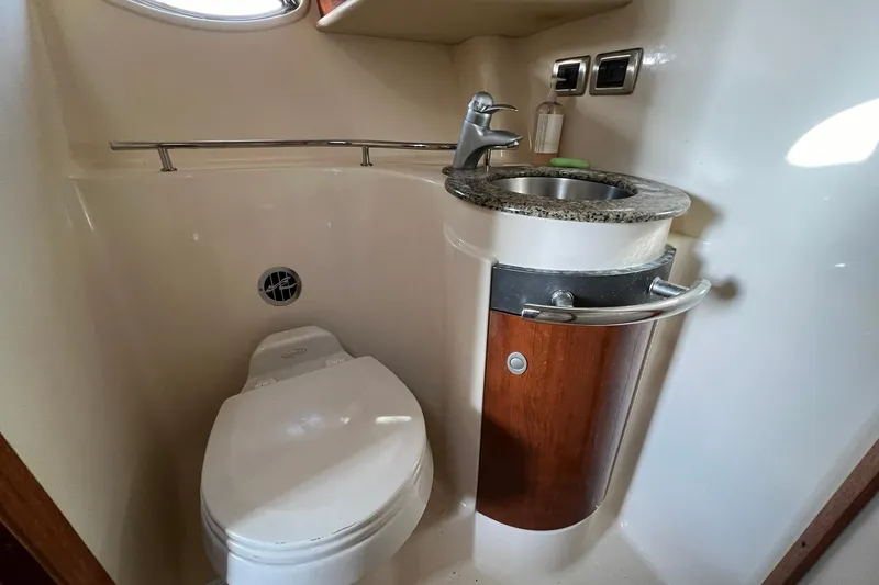 Slide: The Image of Compact bathroom in 2005 Sea Ray 390 Sundancer yacht with sink and toilet. - 54