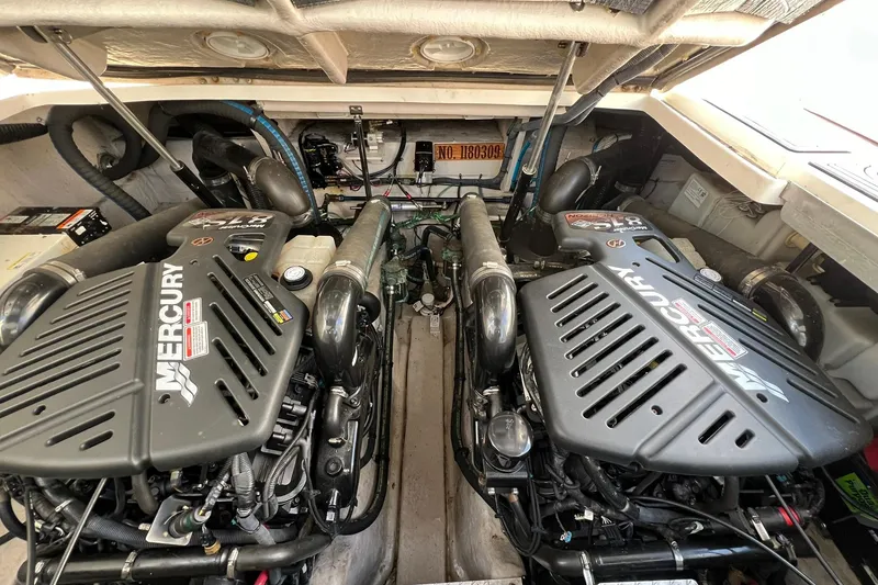 Slide: The Image of Engine room of a 2005 Sea Ray 390 Sundancer with twin Mercury engines. - 60