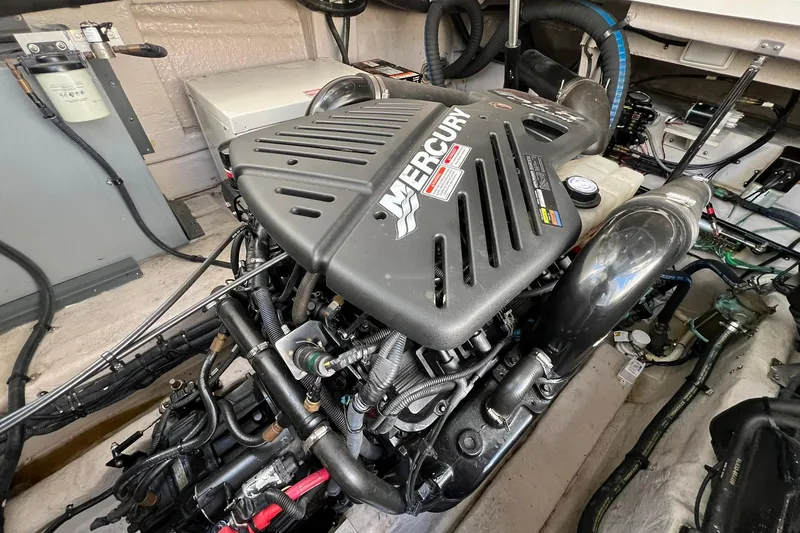 Slide: The Image of Engine compartment of a 2005 Sea Ray 390 Sundancer with a Mercury engine. - 62