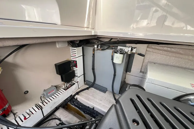 Slide: The Image of Engine compartment of a 2005 Sea Ray 390 Sundancer boat, showcasing mechanical components. - 64