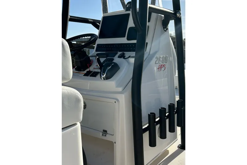 Slide: The Image of 2023 Pathfinder 2600 HPS boat console with steering wheel and controls. - 10