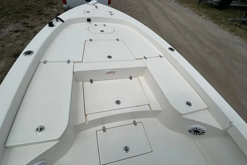 Slide: The Image of 2023 Pathfinder 2600 HPS boat deck with storage compartments and clean design. - 14