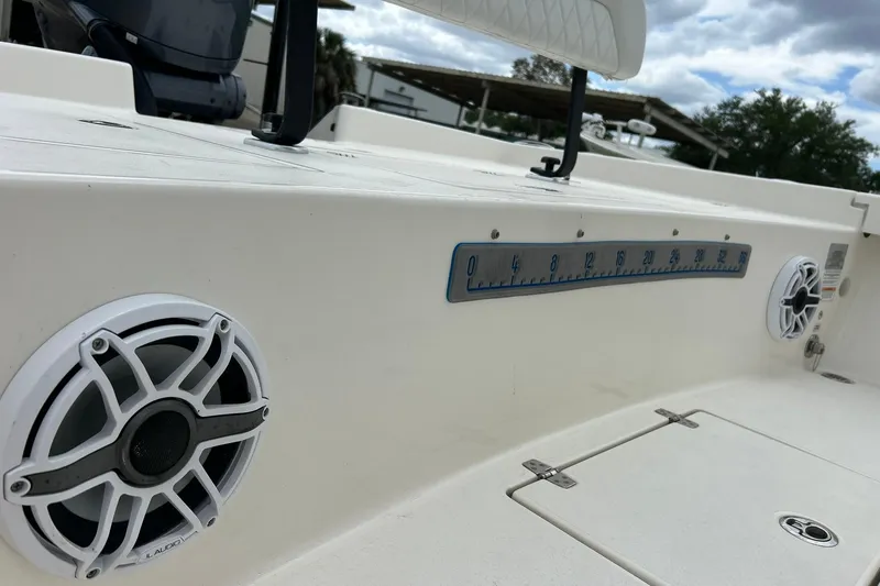 Slide: The Image of 2023 Pathfinder 2600 HPS boat deck with speakers and measurement scale. - 20