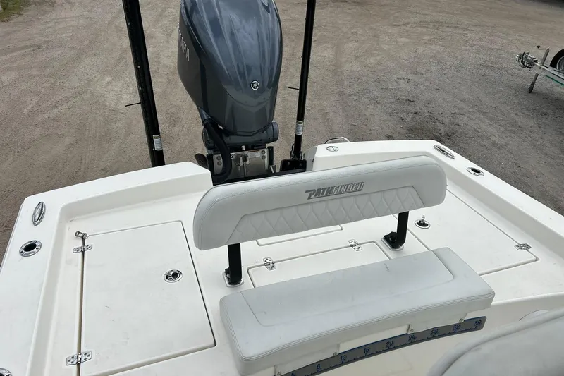 Slide: The Image of 2023 Pathfinder 2600 HPS boat with Yamaha outboard motor, featuring a white cushioned seat. - 21