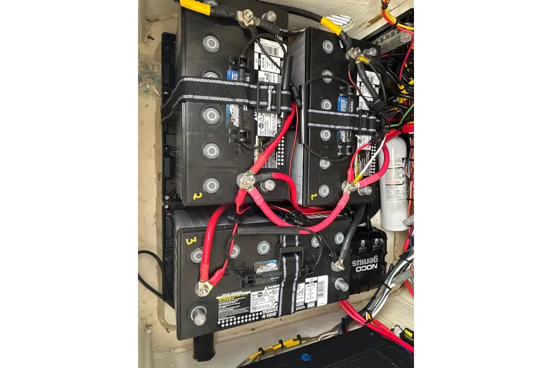 Slide: The Image of Battery setup in a 2023 Pathfinder 2600 HPS boat, featuring multiple connections and wiring. - 22