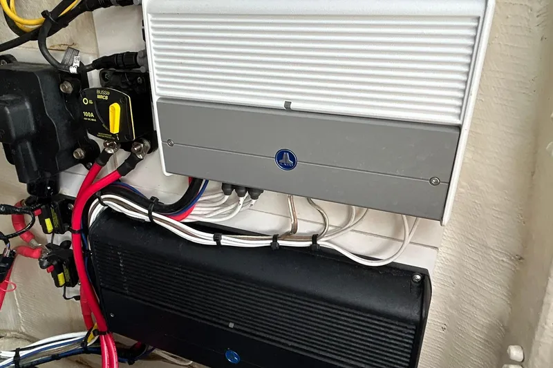 Slide: The Image of Electrical components and wiring inside a 2023 Pathfinder 2600 HPS boat. - 23