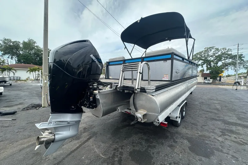 Slide: The Image of 2022 Qwest LTZ 824 pontoon boat with Mercury outboard motor on trailer. - 10