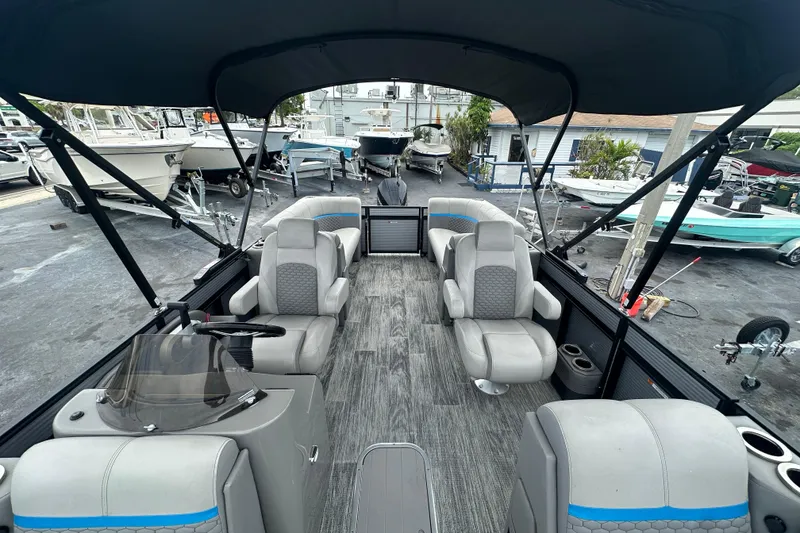 Slide: The Image of Interior view of 2022 Qwest LTZ 824 pontoon boat with spacious seating and canopy. - 15