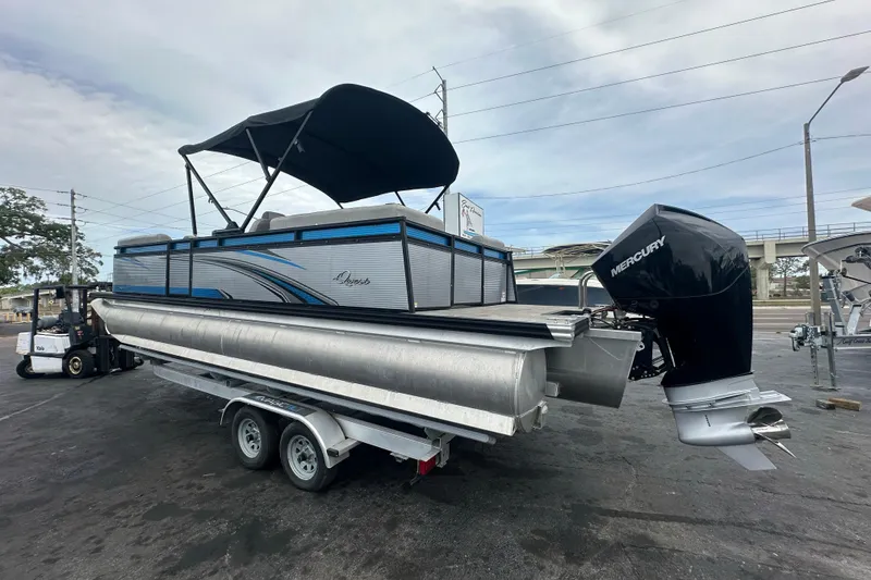 Slide: The Image of 2022 Qwest LTZ 824 pontoon boat with Mercury engine on trailer. - 7