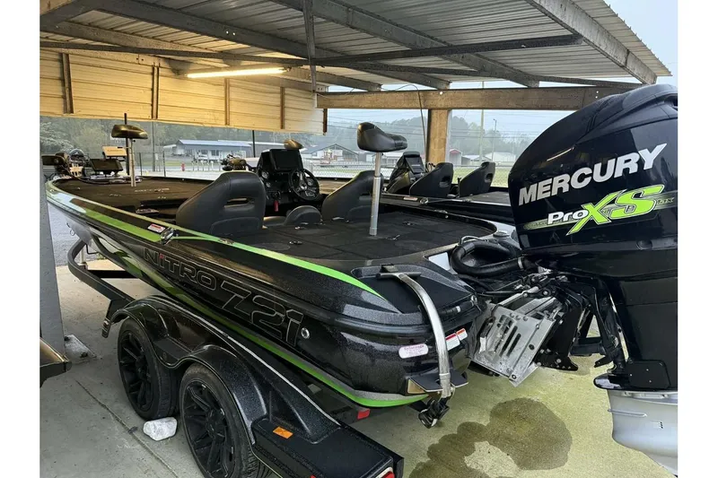 Slide: The Image of 2017 Nitro Z21 Pro boat with Mercury Pro XS engine in covered storage. - 2