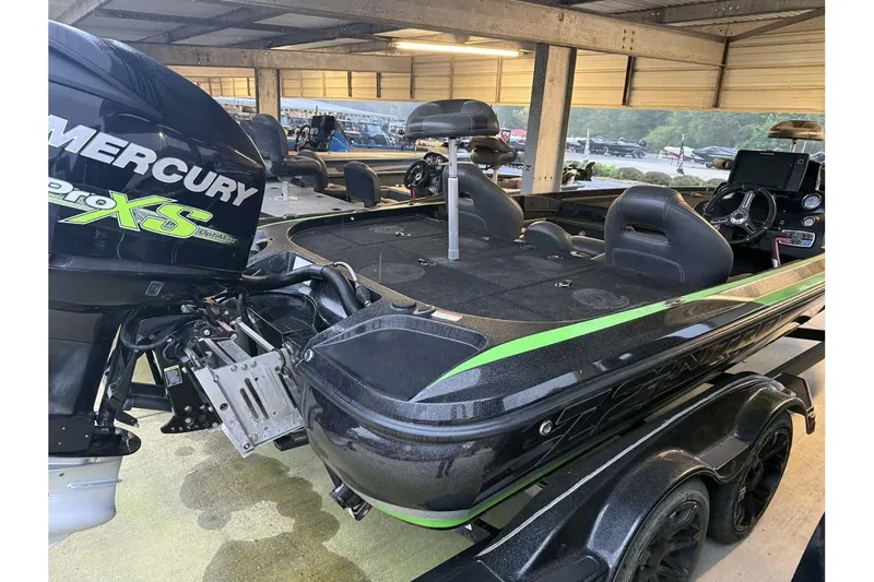 Slide: The Image of 2017 Nitro Z21 Pro boat with Mercury Pro XS engine in a covered storage area. - 3