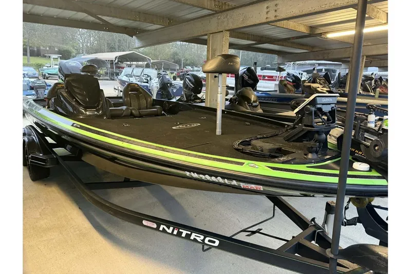 Slide: The Image of 2017 Nitro Z21 Pro bass boat in storage, featuring sleek design and advanced equipment. - 5