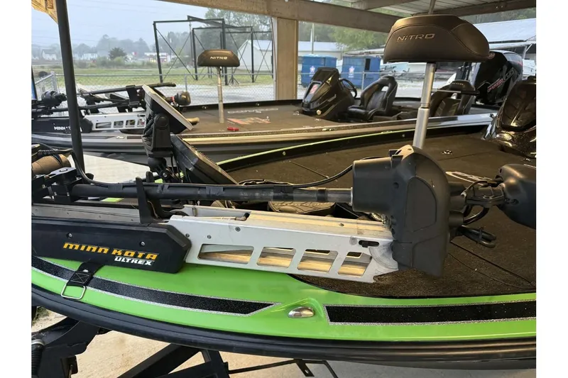 Slide: The Image of 2017 Nitro Z21 Pro boat with Minn Kota Ultrex trolling motor in a covered area. - 7