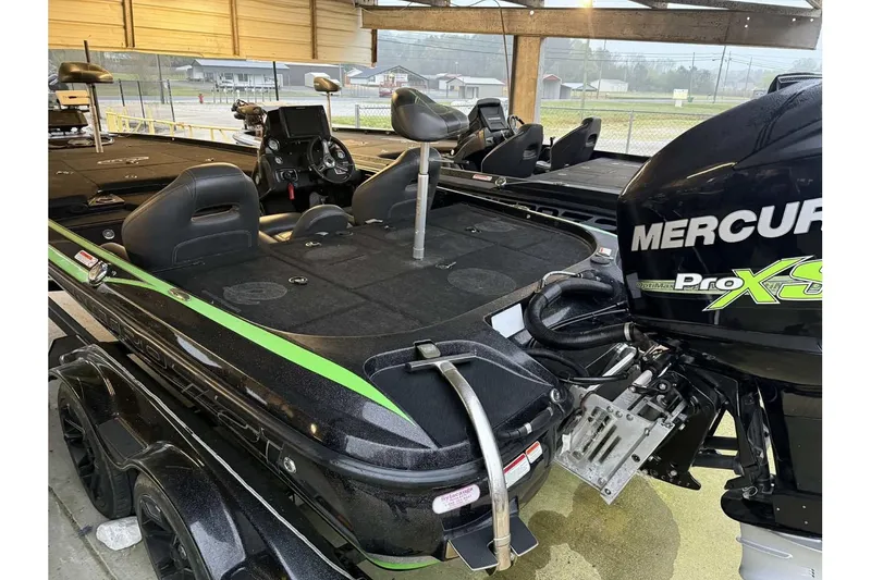 Slide: The Image of 2017 Nitro Z21 Pro fishing boat with Mercury Pro XS engine in a covered area. - 8