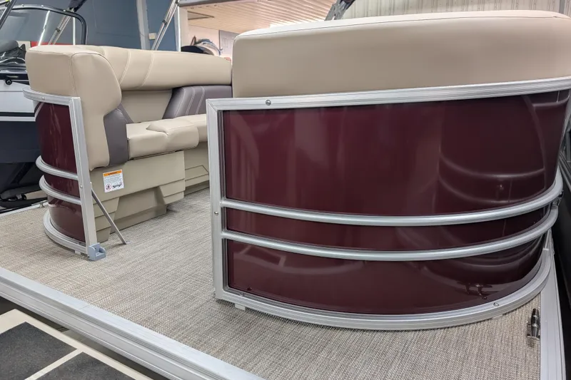 Slide: The Image of 2026 Sylvan Mirage 818 Cruise pontoon boat with beige seating and maroon exterior. - 2