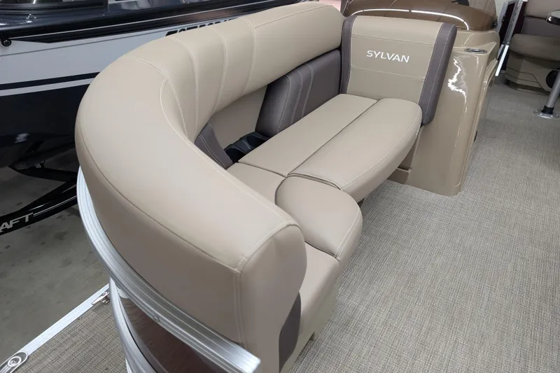 Slide: The Image of 2026 Sylvan Mirage 818 Cruise boat interior with beige seating and sleek design. - 3