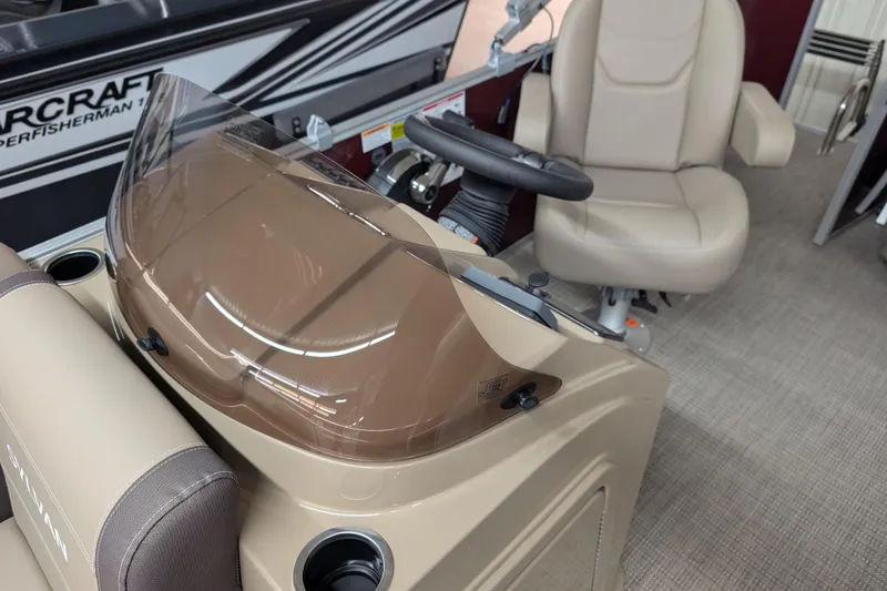 Slide: The Image of Interior of 2026 Sylvan Mirage 818 Cruise boat with steering wheel and seating. - 6