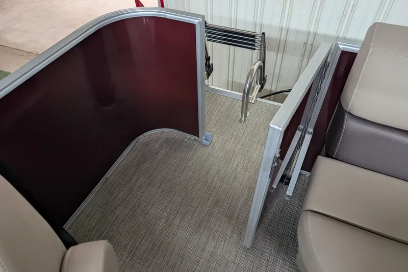Slide: The Image of Interior of 2026 Sylvan Mirage 818 Cruise boat, featuring seating and entry gate. - 7