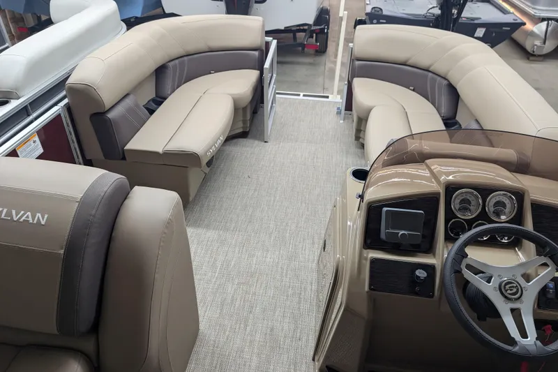 Slide: The Image of Interior of 2026 Sylvan Mirage 818 Cruise pontoon boat with plush seating and modern dashboard. - 9
