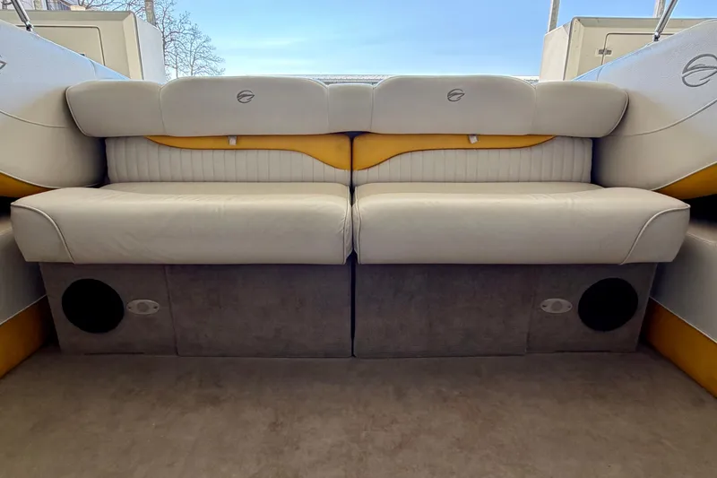 Slide: The Image of 2006 Crownline 266 BR boat interior with white and yellow seating. - 16