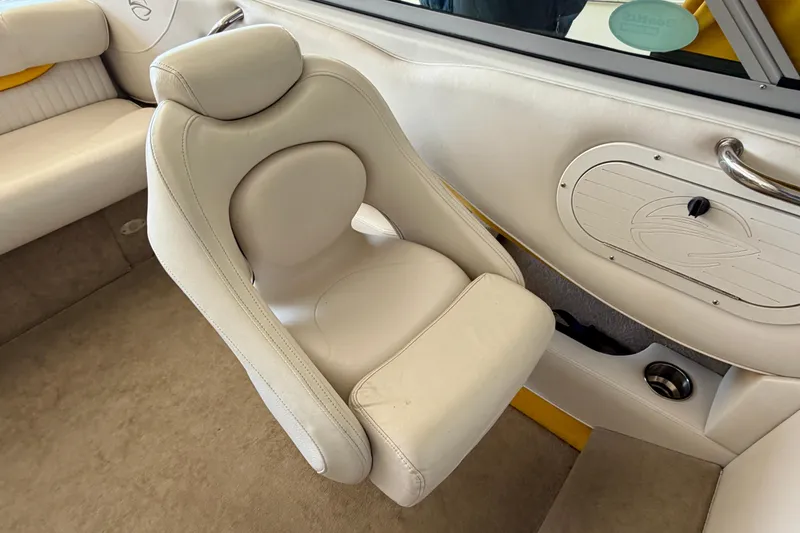 Slide: The Image of 2006 Crownline 266 BR boat interior with white leather seating and sleek design. - 18