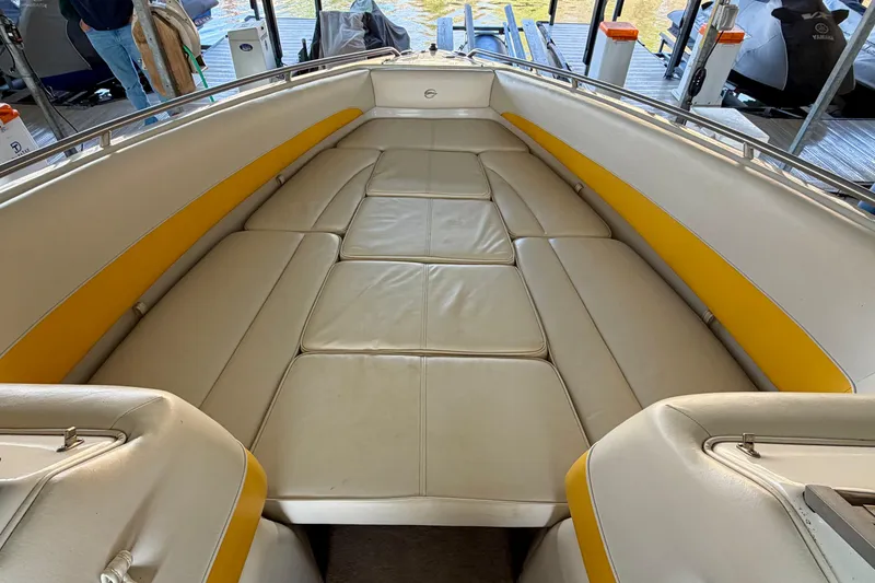 Slide: The Image of 2006 Crownline 266 BR boat interior with yellow and white seating. - 26