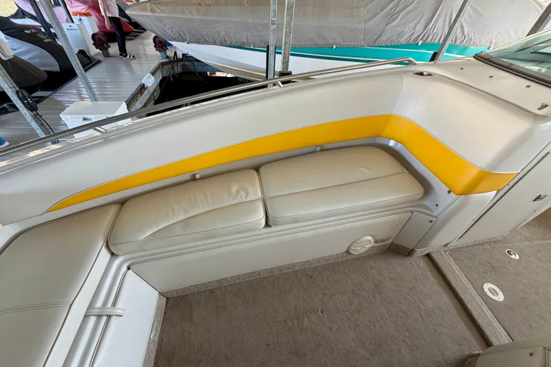 Slide: The Image of 2006 Crownline 266 BR boat interior with white and yellow seating. - 27