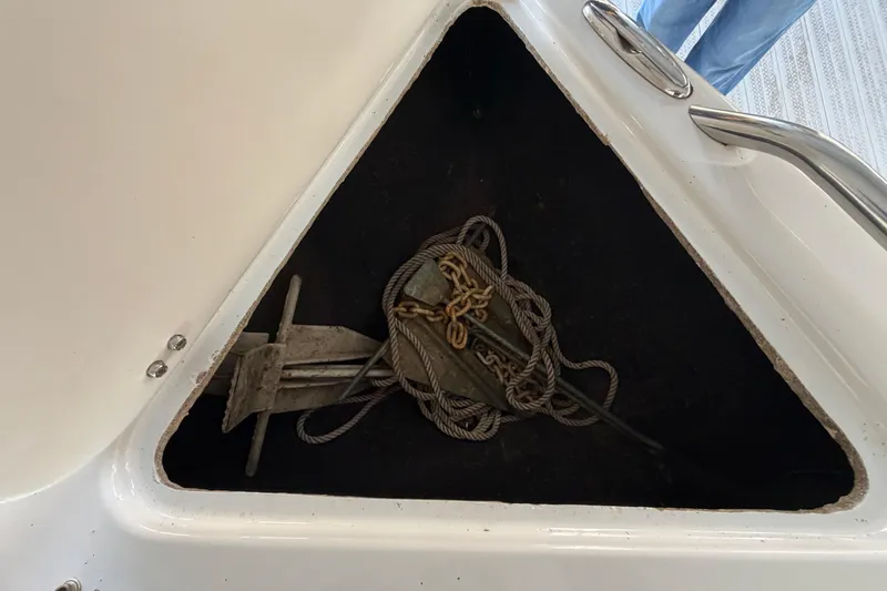 Slide: The Image of Anchor storage compartment on a 2006 Crownline 266 BR boat. - 31