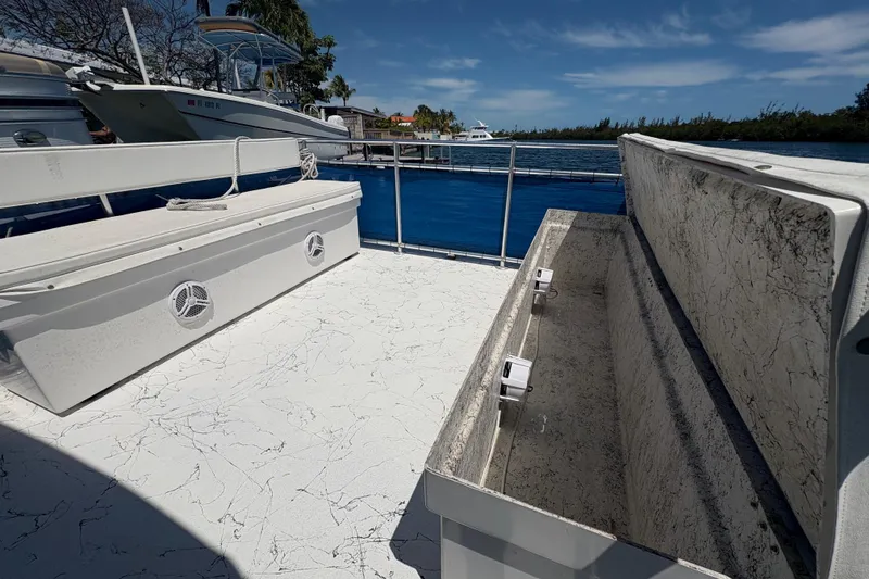 Slide: The Image of Open deck of 2021 A&M Manufacturing Salty boat with storage compartments. - 13